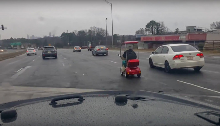 Old Man Caught On Video Driving Wheel Chair Down Charlotte Highway During Winter Storm Helena