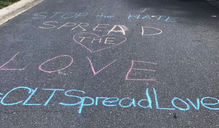 Messages of Love Flood The Streets Around Home of Racist Graffiti Victims