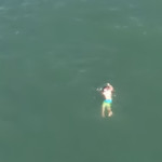 man-swims-into-ocean-to-evade-police