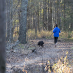 flat branch nature preserve woman walking dog charlotte