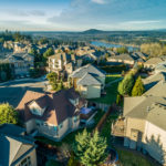 Beautiful luxury neighborhood in the Pacific Northwest photographed at sunset from the air