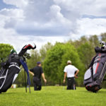 Golf bags with group of players