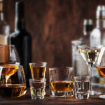 Strong Spirits Set. Hard alcoholic drinks in glasses in assortment: vodka, cognac, tequila, brandy and whiskey, grappa, liqueur, vermouth, tincture, rum.