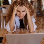 stressed woman at computer