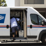 Fullerton, California, USA – July 6, 2021: A USPS Postal worker