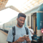 portrait of young man in a railway station