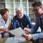 Senior couple planning their investments with financial advisor