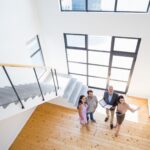 Real estate agent showing new house to couple